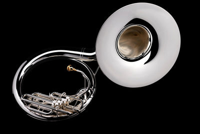 How is a concert tuba different from a sousaphone?